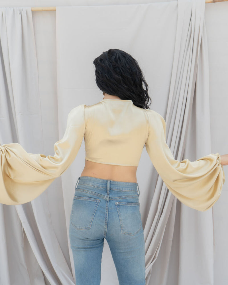 SATIN WRAP TOP WITH DRAMATIC SLEEVES IN GOLD